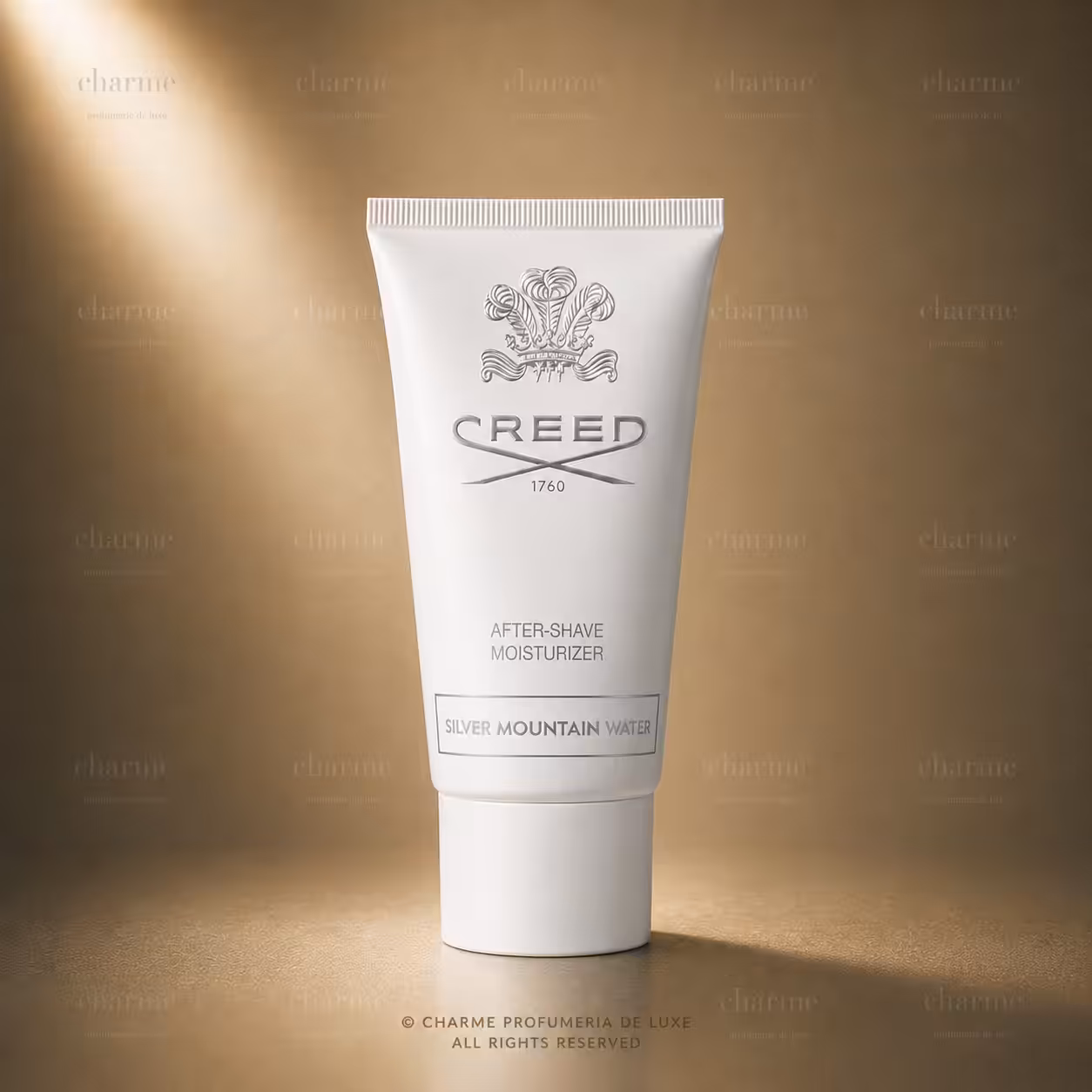 Creed Silver Mountain Water After-Shave Moisturizer, trattamento dopobarba Creed in tubo bianco su sfondo luxury dorato.