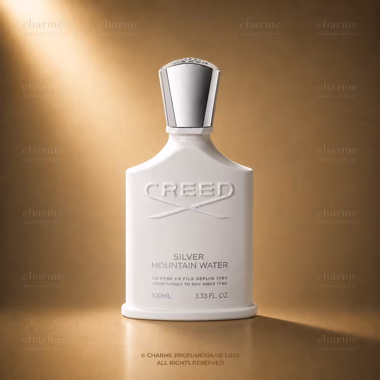 White perfume bottle with silver cap, embossed CREED, labeled 'Silver Mountain Water' on a warm gold background.