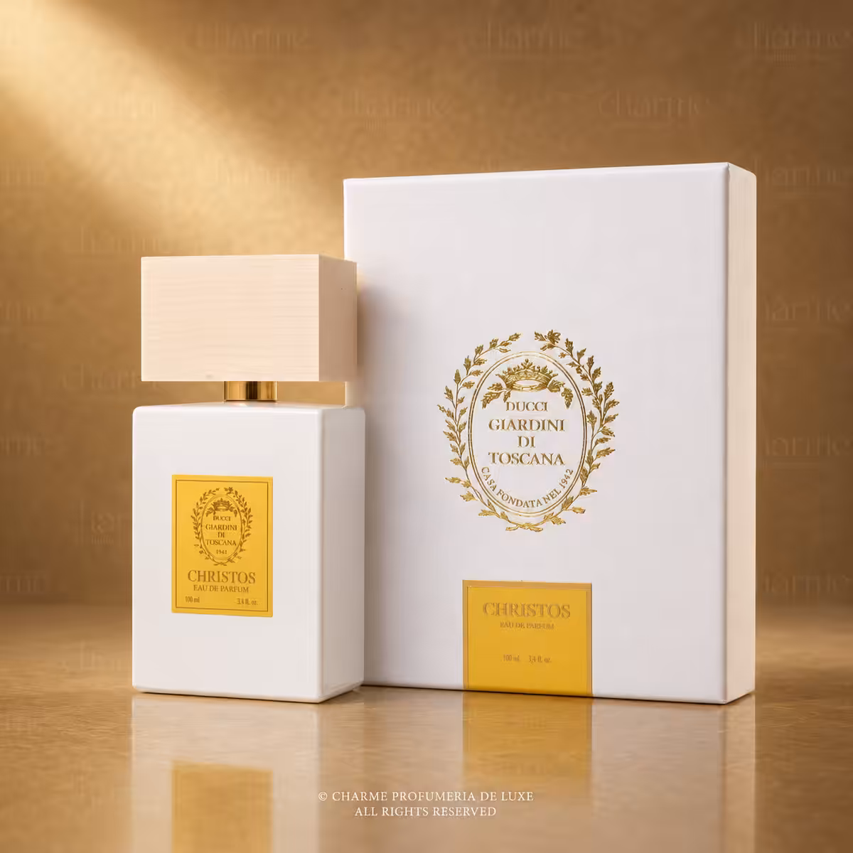 Giardini di Toscana Christos Eau de Parfum 100 ml con flacone bianco e confezione, profumo di nicchia su sfondo luxury dorato