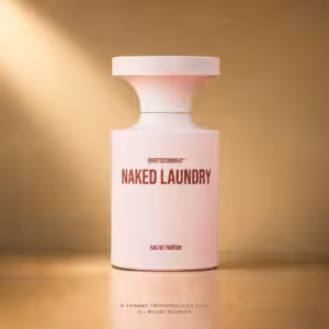 Borntostandout Naked Laundry Eau de Parfum 100 ml, profumo di nicchia in packshot luxury su sfondo oro champagne per Charme Profumeria de Luxe