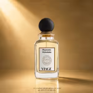 Viage Hypnotic Honolulu Extrait de Parfum 100 ml, flacone in vetro trasparente con liquido ambrato su sfondo dorato Charme Profumeria de Luxe