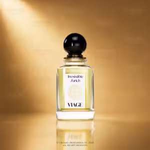 Viage Irresistible Zurich Extrait de Parfum 100 ml, flacone trasparente con dettagli oro e tappo nero su sfondo dorato Charme Profumeria de Luxe