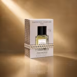 Boxed Essential Parfums fragrance with a small bottle visible inside, set against a gold backdrop.