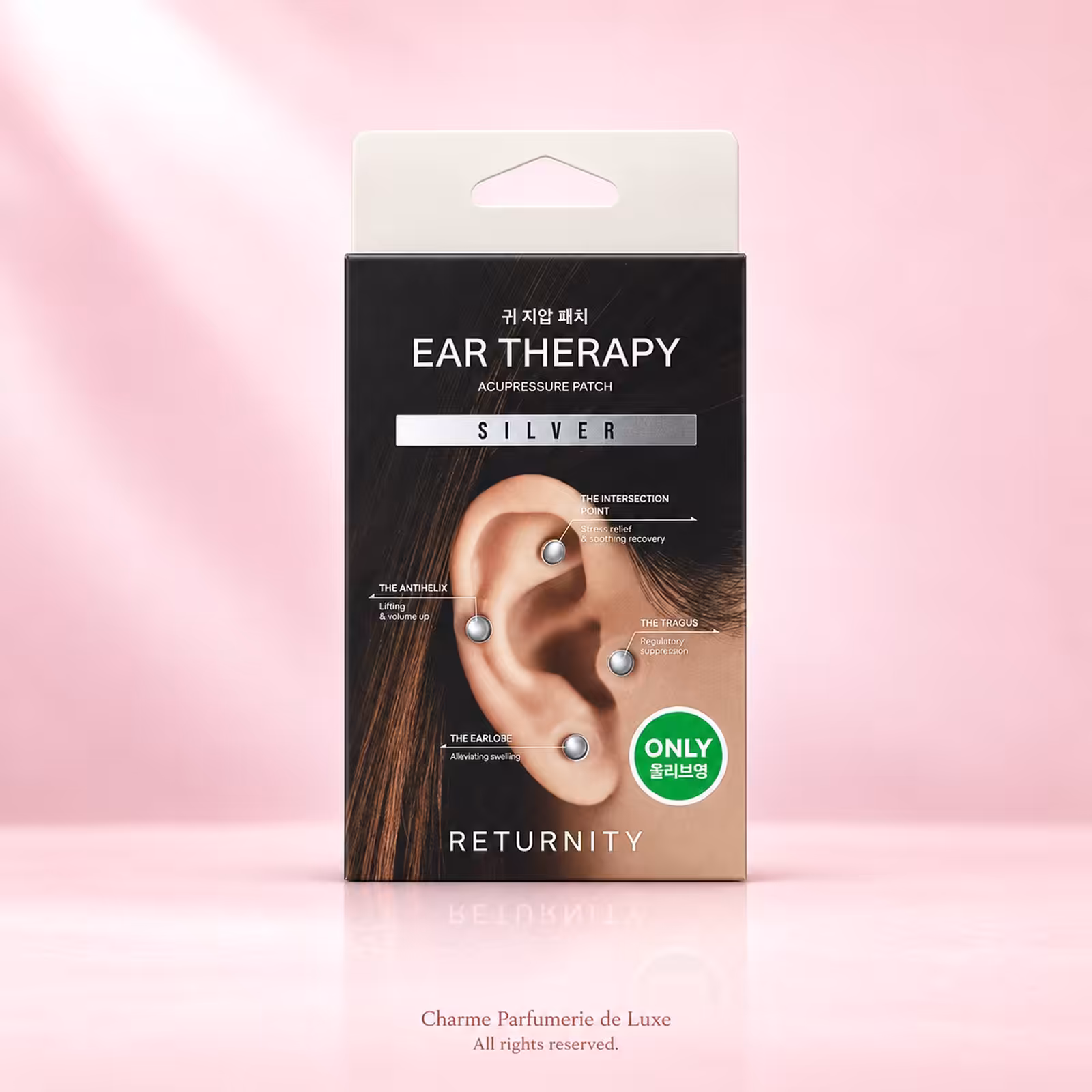 RETURNITY Ear Therapy Acupressure Patch Silver, confezione nera di patch auricolari decorativi su sfondo rosa.